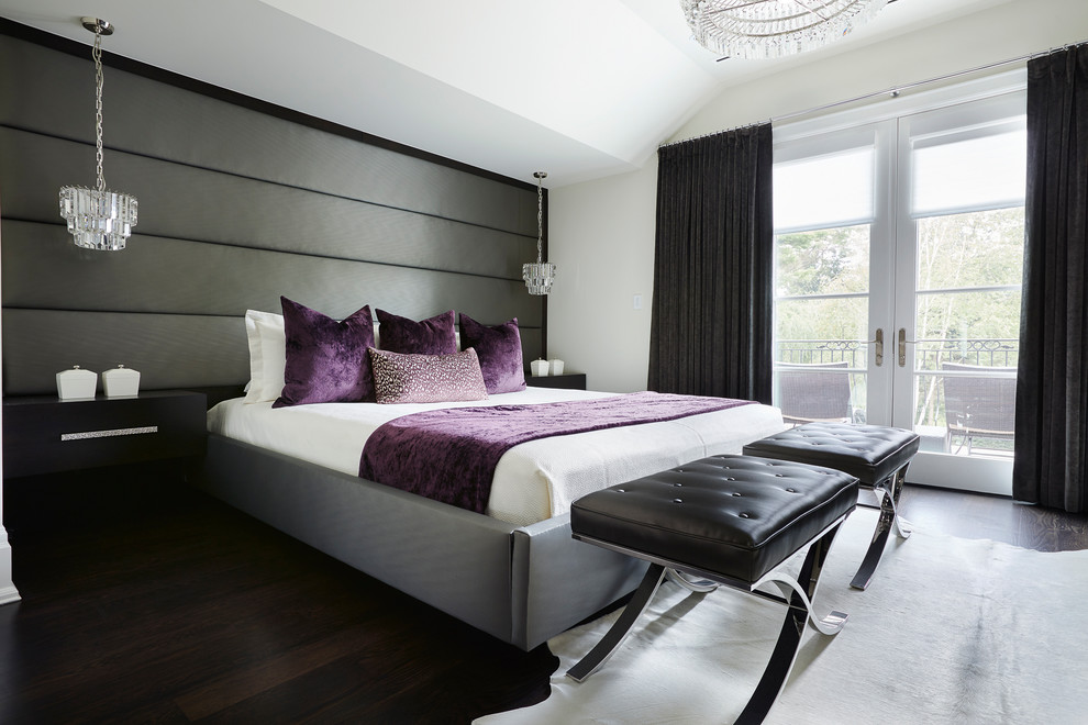Classic master bedroom in Toronto with white walls and dark hardwood flooring.