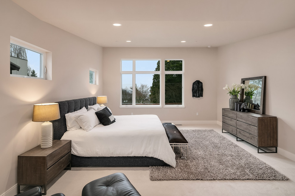 Design ideas for a classic bedroom in Seattle with beige walls, carpet and beige floors.
