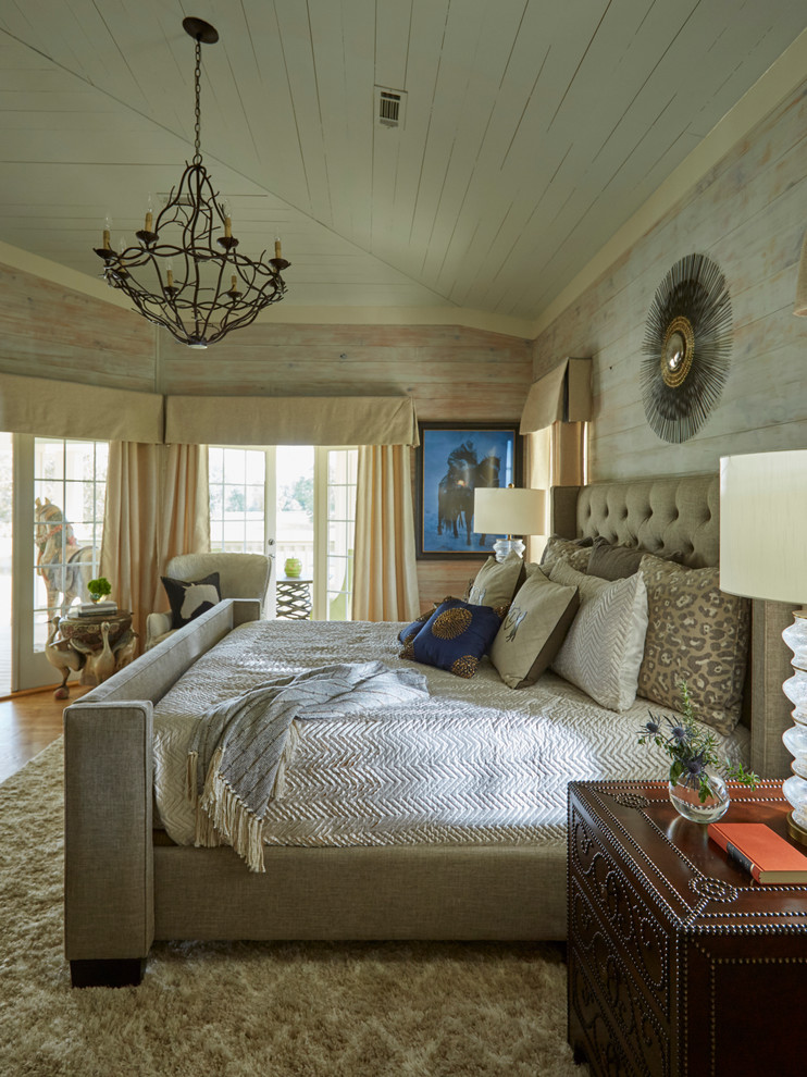 Inspiration for a country master bedroom in Miami with medium hardwood flooring.