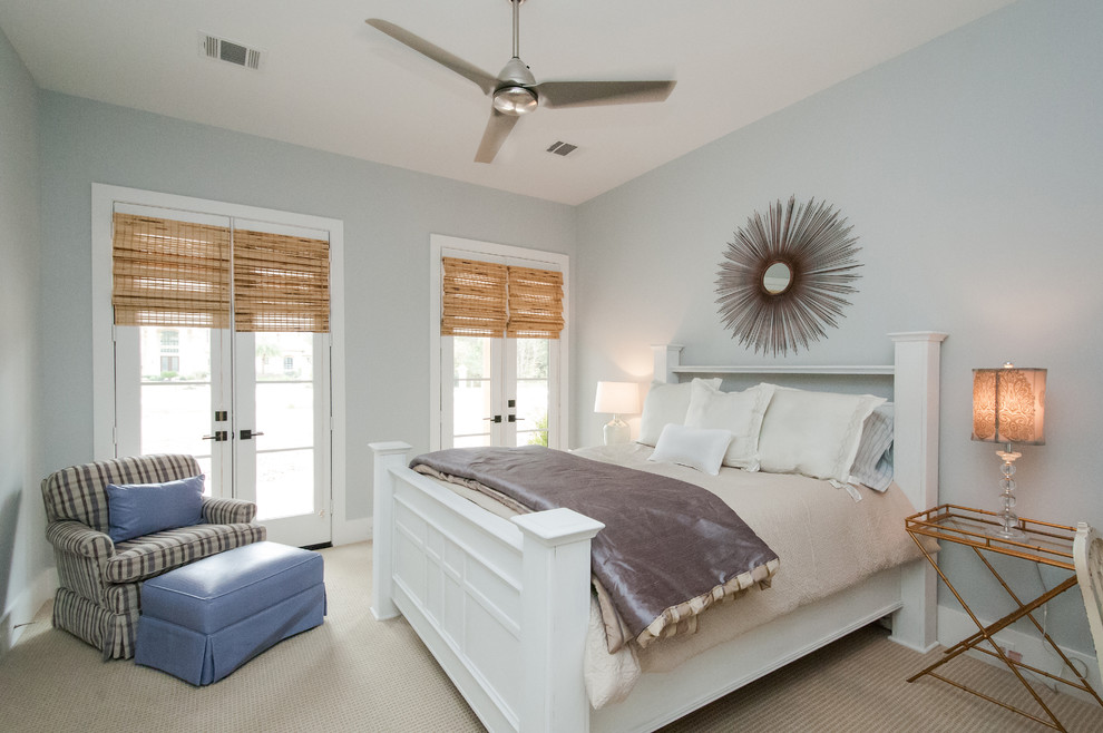 Example of a large country guest carpeted and beige floor bedroom design in Houston with blue walls