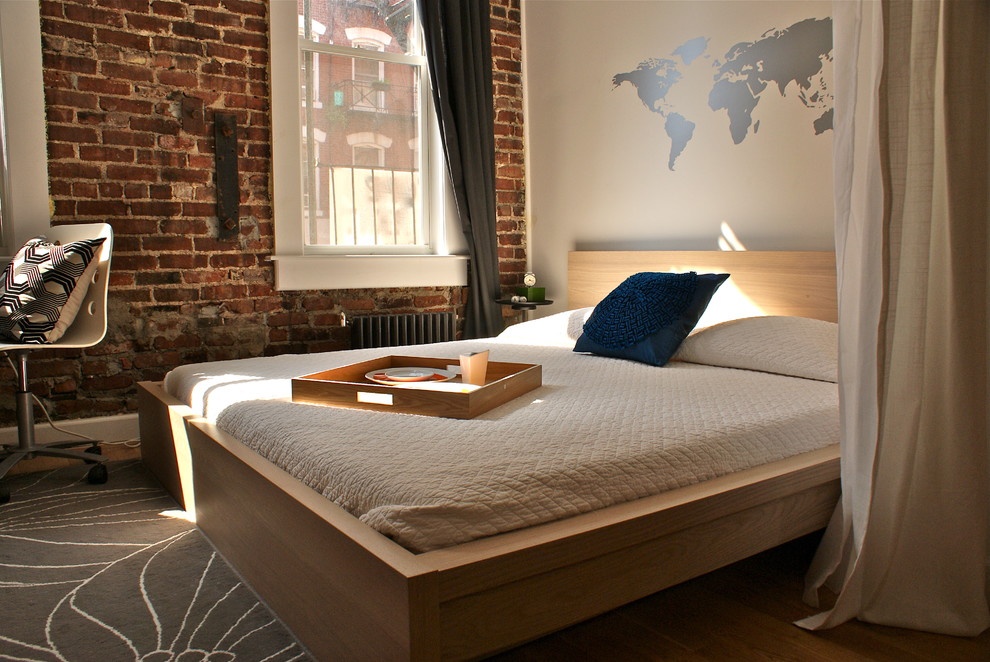 Bedroom - modern bedroom idea in New York with beige walls