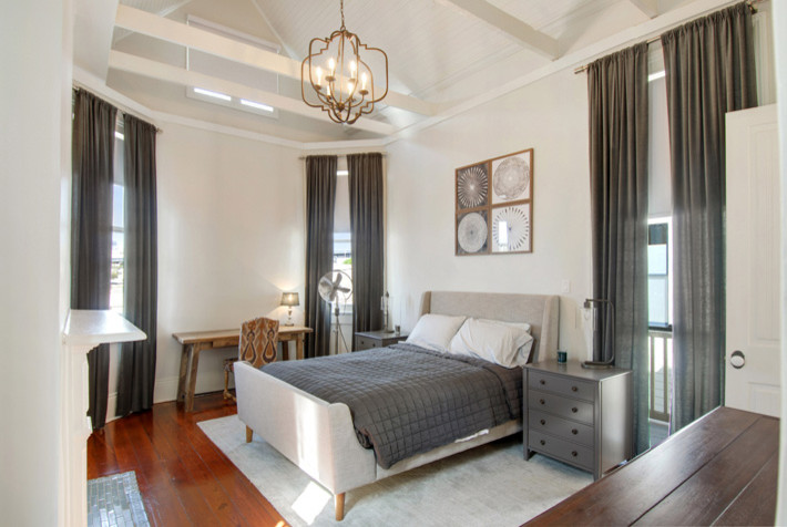 Photo of a large classic master bedroom in New Orleans with white walls, dark hardwood flooring and no fireplace.