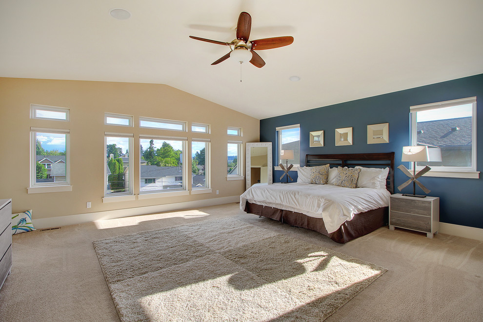 Photo of a large traditional master bedroom in Seattle with multi-coloured walls, carpet and beige floors.