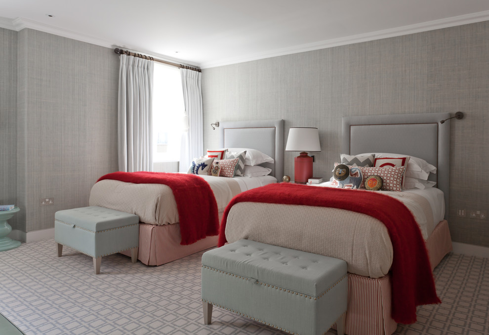 Example of a mid-sized transitional guest carpeted bedroom design in London with gray walls