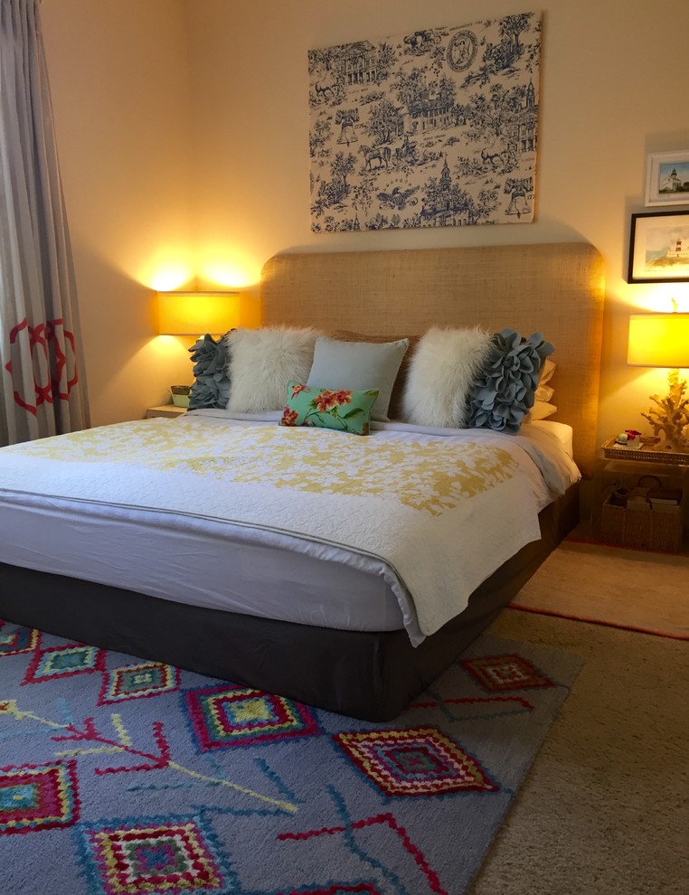 Photo of a small eclectic master bedroom in San Diego with beige walls and carpet.