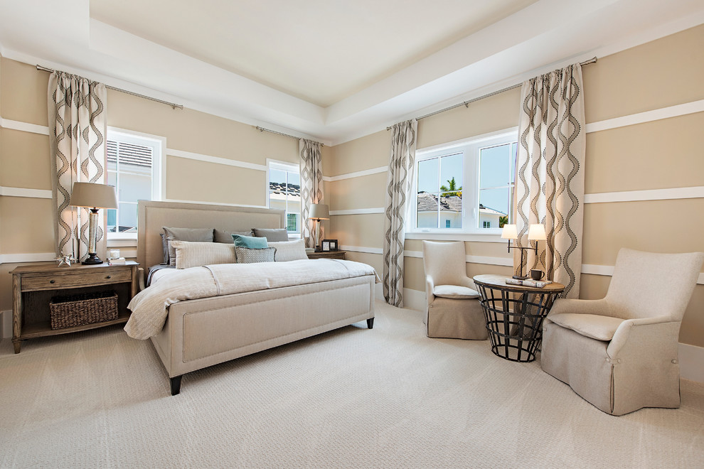 Classic master and grey and brown bedroom in Miami with beige walls, carpet, feature lighting, beige floors and a drop ceiling.