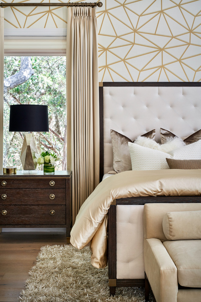 Design ideas for a large classic master bedroom in Austin with white walls, light hardwood flooring and brown floors.