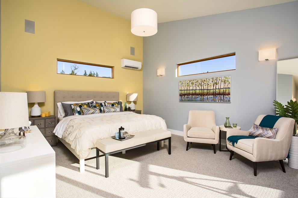 Photo of a contemporary master bedroom in Seattle with yellow walls, carpet and no fireplace.