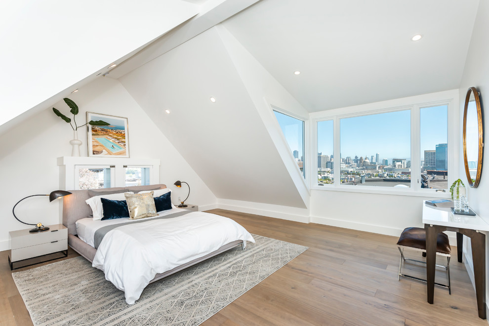 This is an example of a medium sized contemporary guest bedroom in San Francisco with white walls, dark hardwood flooring, no fireplace and brown floors.