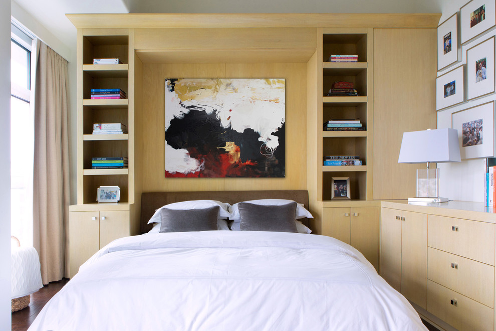 This is an example of a contemporary bedroom in Los Angeles with no fireplace.