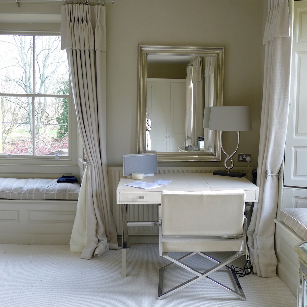 Example of a trendy carpeted bedroom design in Kent with beige walls