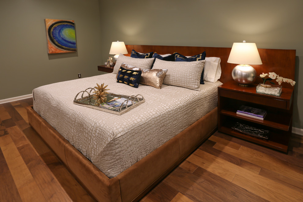 Bedroom - modern guest medium tone wood floor and brown floor bedroom idea in Other with green walls