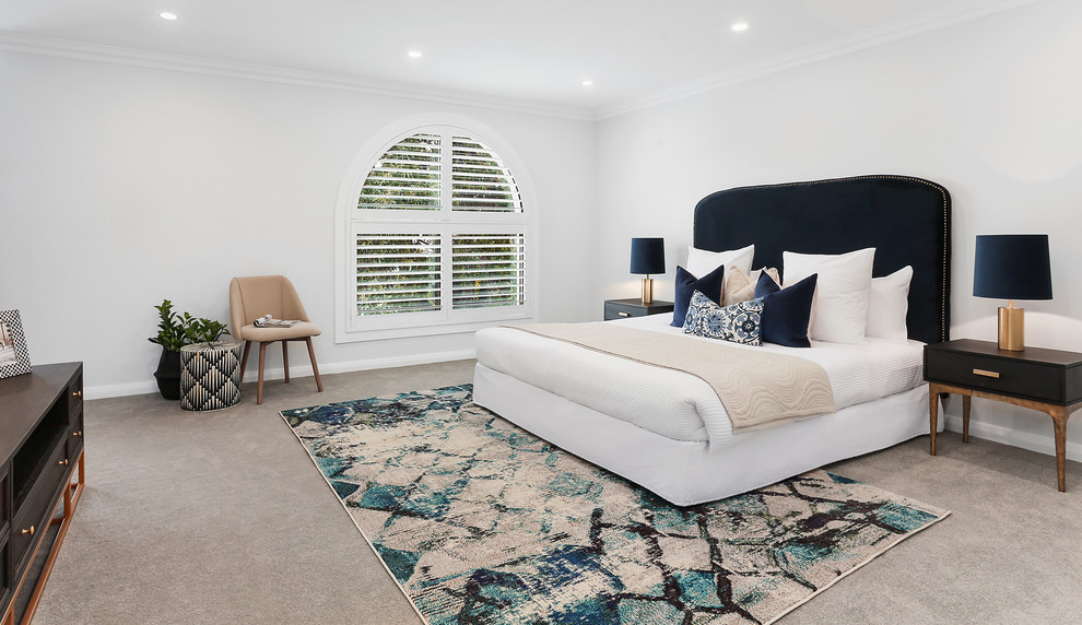 Example of a huge trendy master carpeted and gray floor bedroom design in Sydney with white walls