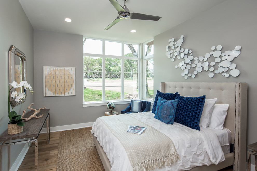 Bedroom - contemporary medium tone wood floor bedroom idea in Austin with gray walls