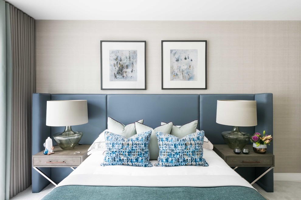 Photo of a medium sized contemporary bedroom in London with beige walls, carpet and grey floors.