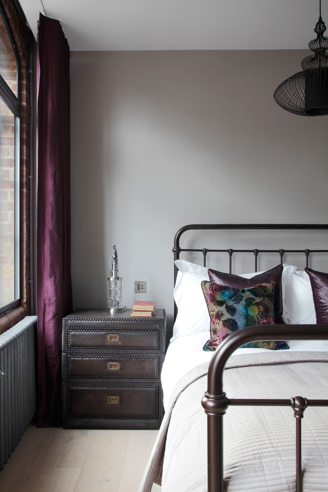 Design ideas for a medium sized urban guest bedroom in London with grey walls.
