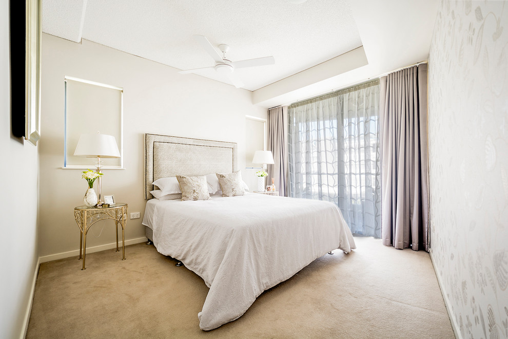 This is an example of a small traditional guest bedroom in Other with beige walls, carpet and beige floors.