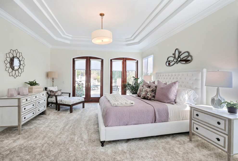 Inspiration for a large timeless master carpeted and gray floor bedroom remodel in San Francisco with beige walls