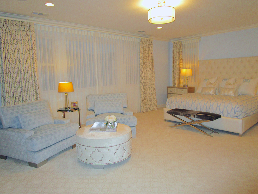 Example of a large transitional master carpeted bedroom design in San Diego with blue walls and no fireplace