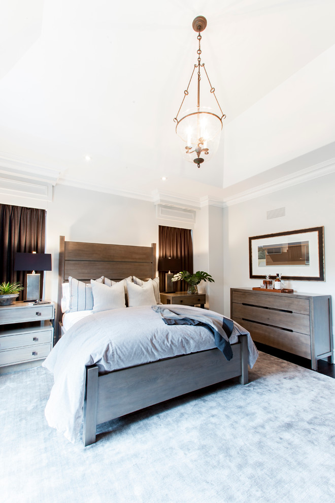 Classic guest bedroom in Toronto with white walls and dark hardwood flooring.
