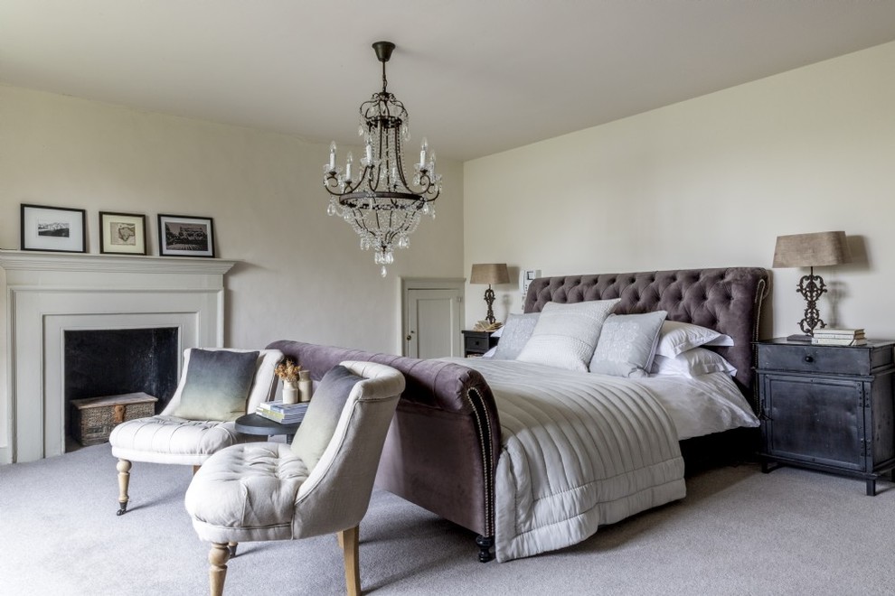 Medium sized classic master bedroom in Devon with carpet, a standard fireplace, grey floors and beige walls.