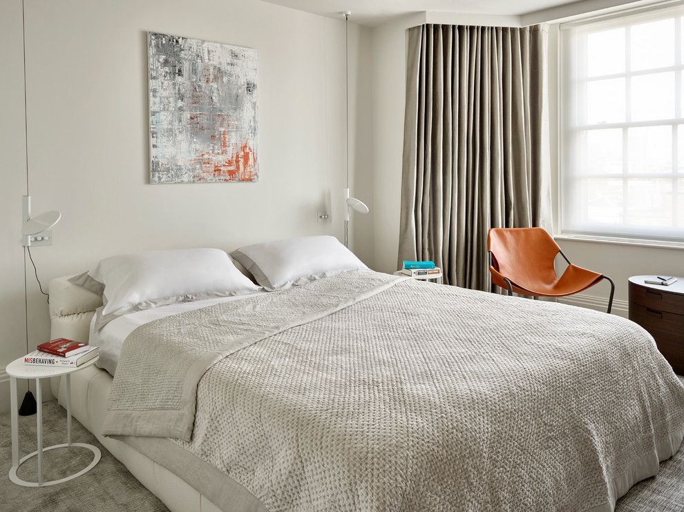Design ideas for a large contemporary guest bedroom in London.