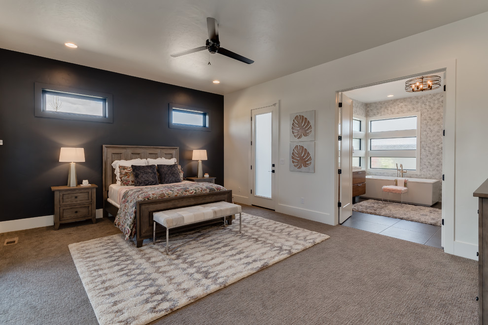Example of a mid-sized minimalist master carpeted and beige floor bedroom design in Boise with white walls and no fireplace