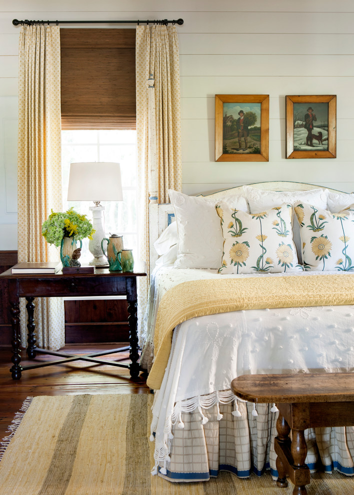 Inspiration for a farmhouse master bedroom in Atlanta with white walls and medium hardwood flooring.