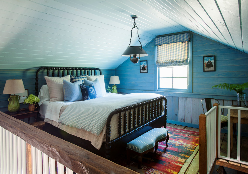 Example of a cottage loft-style bedroom design in Atlanta with blue walls