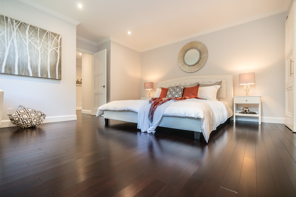 Inspiration for a large modern master dark wood floor bedroom remodel in Montreal with white walls