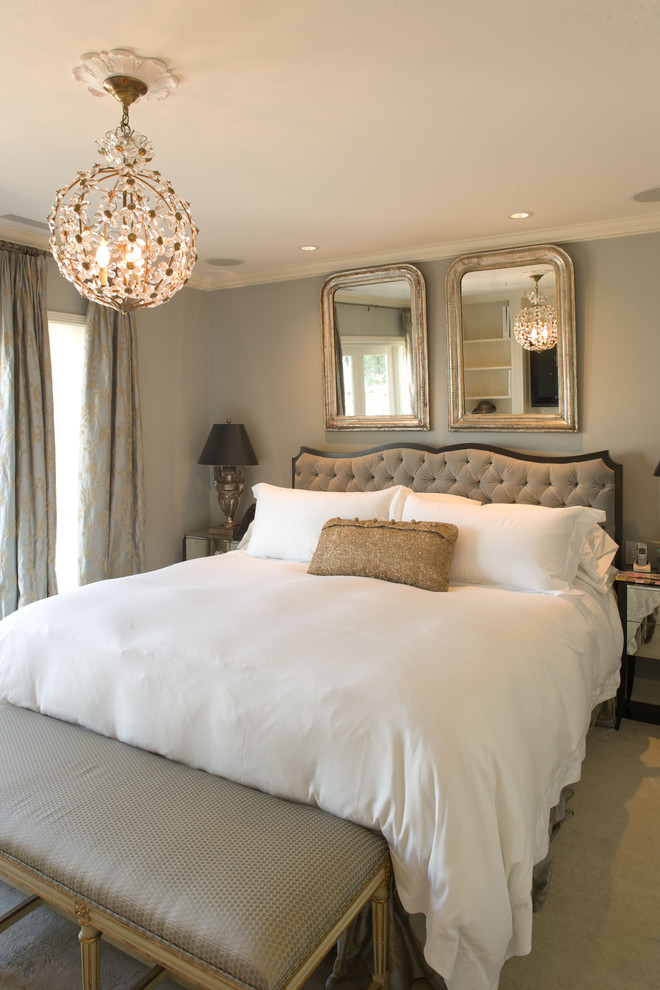 This is an example of a traditional grey and silver bedroom in Seattle with grey walls.