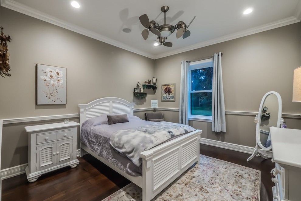Design ideas for a classic guest bedroom in New York with dark hardwood flooring, brown floors and grey walls.