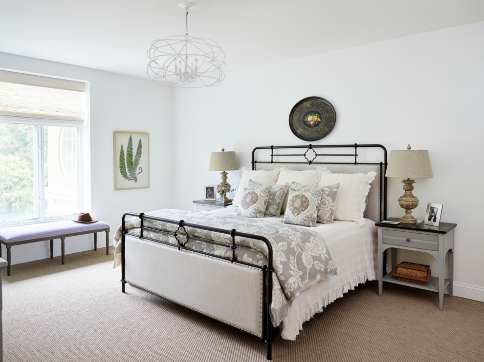 This is an example of a medium sized traditional master and grey and brown bedroom in Philadelphia with white walls, carpet and brown floors.
