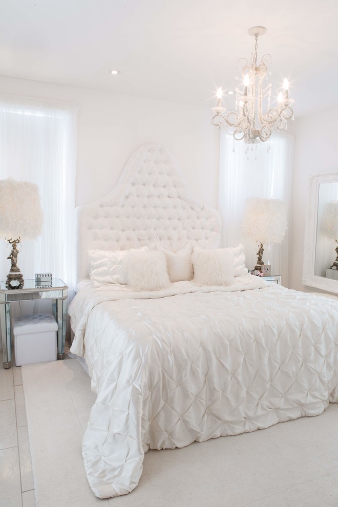 Photo of a large modern master bedroom in Montreal with white walls, porcelain flooring and beige floors.