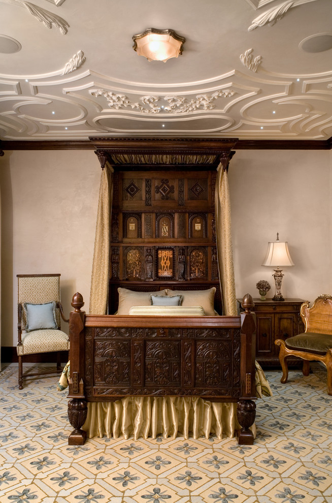 This is an example of a classic master bedroom in Austin with beige walls.