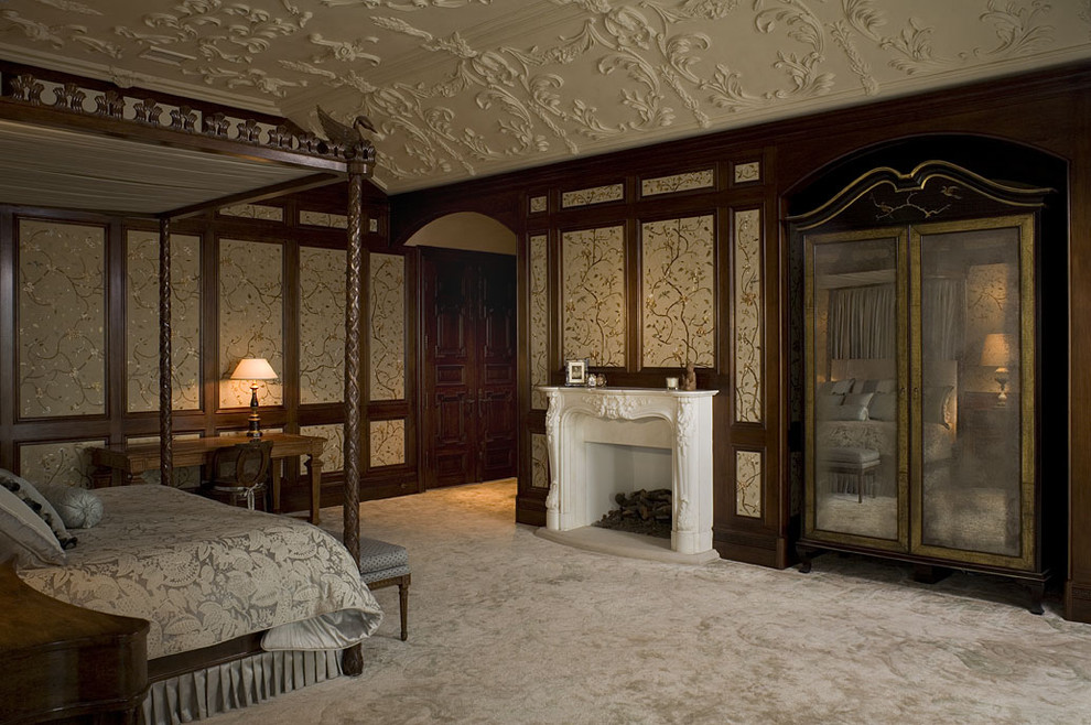 Photo of a traditional bedroom in Austin with beige walls, carpet and a standard fireplace.