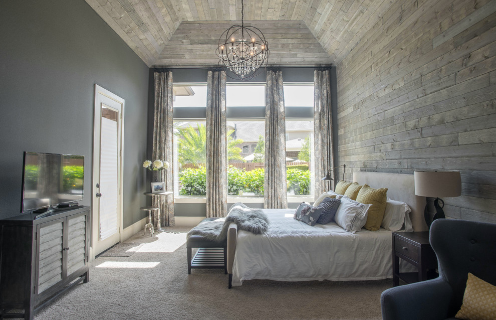 Large classic master bedroom in Houston with grey walls and carpet.