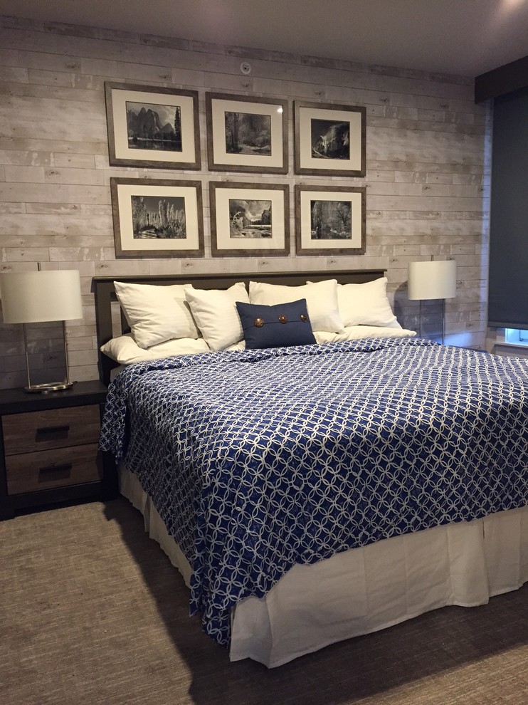 Imagen de dormitorio principal actual pequeño con paredes grises y moqueta