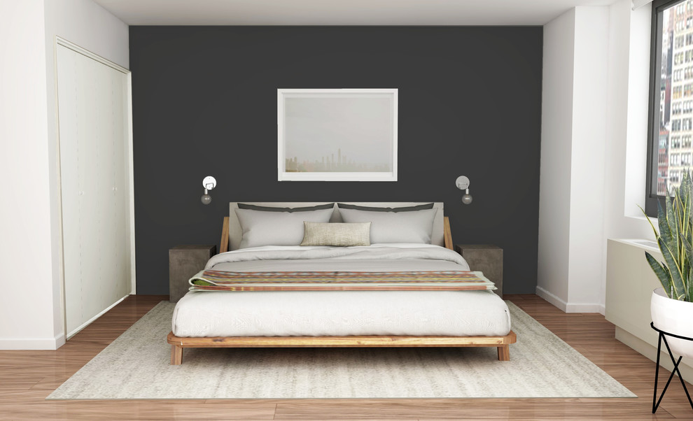 Kleines Retro Hauptschlafzimmer ohne Kamin mit grauer Wandfarbe und braunem Holzboden in New York