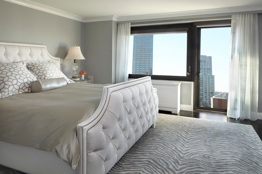 Classic master bedroom in New York with grey walls.
