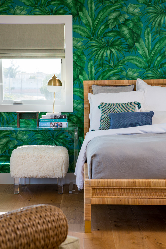Photo of a large coastal master bedroom in Los Angeles with light hardwood flooring, green walls and orange floors.