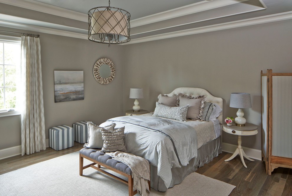 This is an example of a medium sized farmhouse guest bedroom in Atlanta with grey walls, medium hardwood flooring and no fireplace.