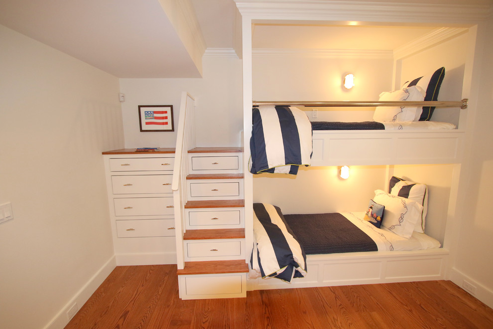 Large beach style guest medium tone wood floor bedroom photo in Boston with white walls