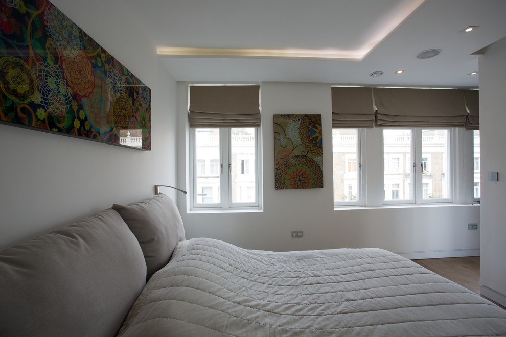 Photo of a medium sized contemporary master bedroom in London.