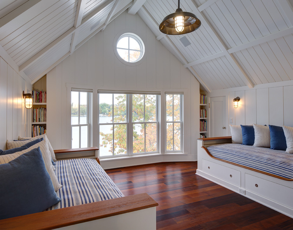 Design ideas for a coastal guest bedroom in Milwaukee with white walls and dark hardwood flooring.