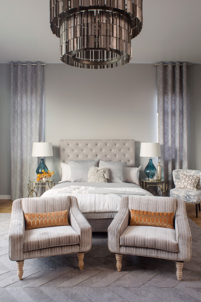 Photo of a contemporary grey and cream bedroom in Other with grey walls.