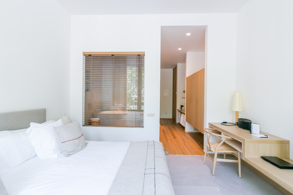 Large danish master bedroom photo in Barcelona with white walls and no fireplace