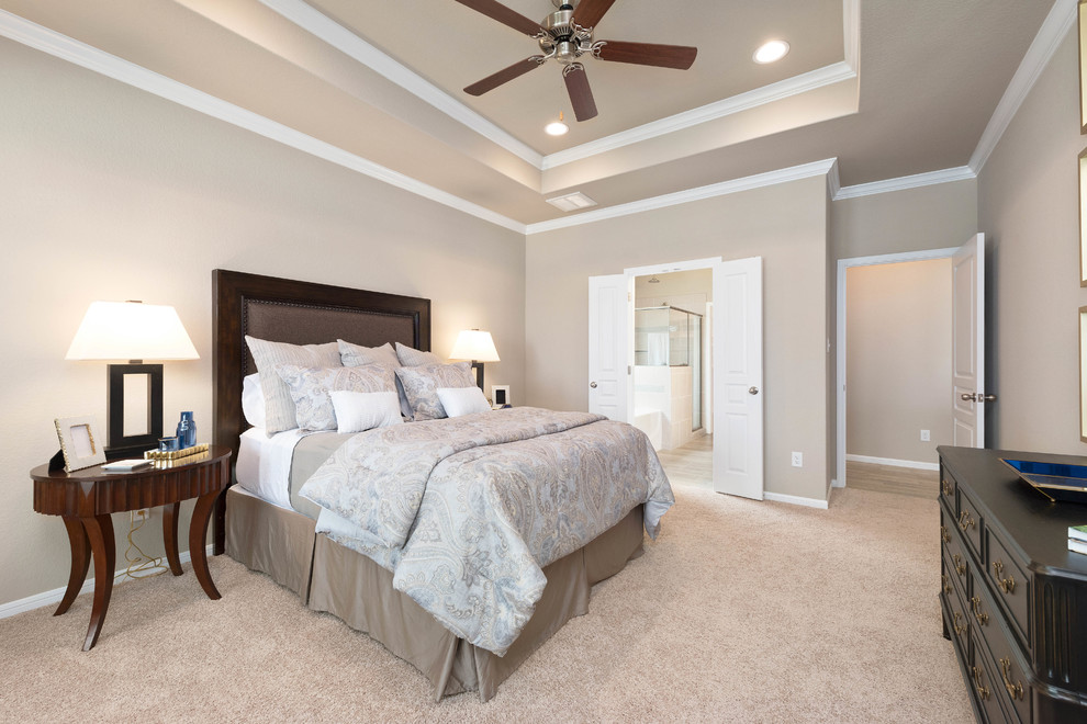Bedroom - large traditional master carpeted and beige floor bedroom idea in Austin with beige walls and no fireplace