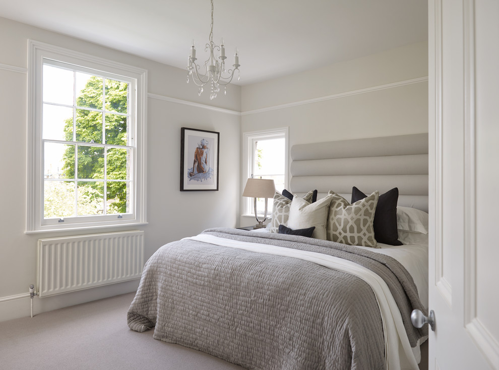 Photo of a classic bedroom in London with grey walls and carpet.