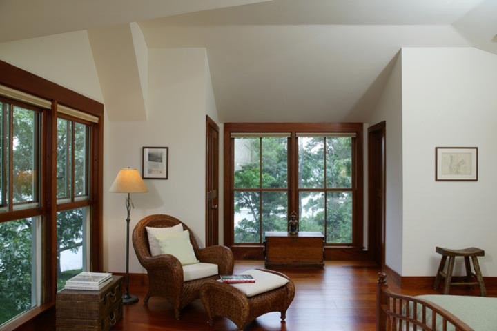 Design ideas for a large classic master bedroom in Boston with white walls and medium hardwood flooring.